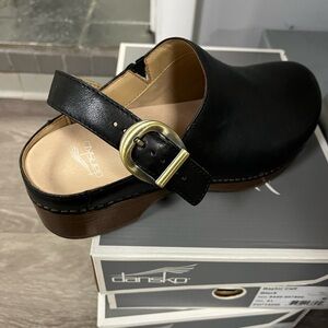 Dansko Black Leather Mules with Gold Buckle
